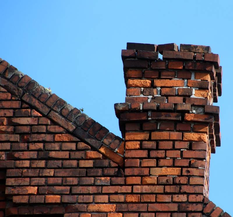 Signs Your El Monte Home Needs a Chimney Inspection Damaged chimney on an El Monte home showing cracks and missing mortar